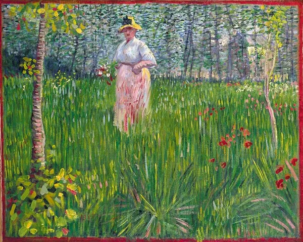 A Woman Walking in a Garden